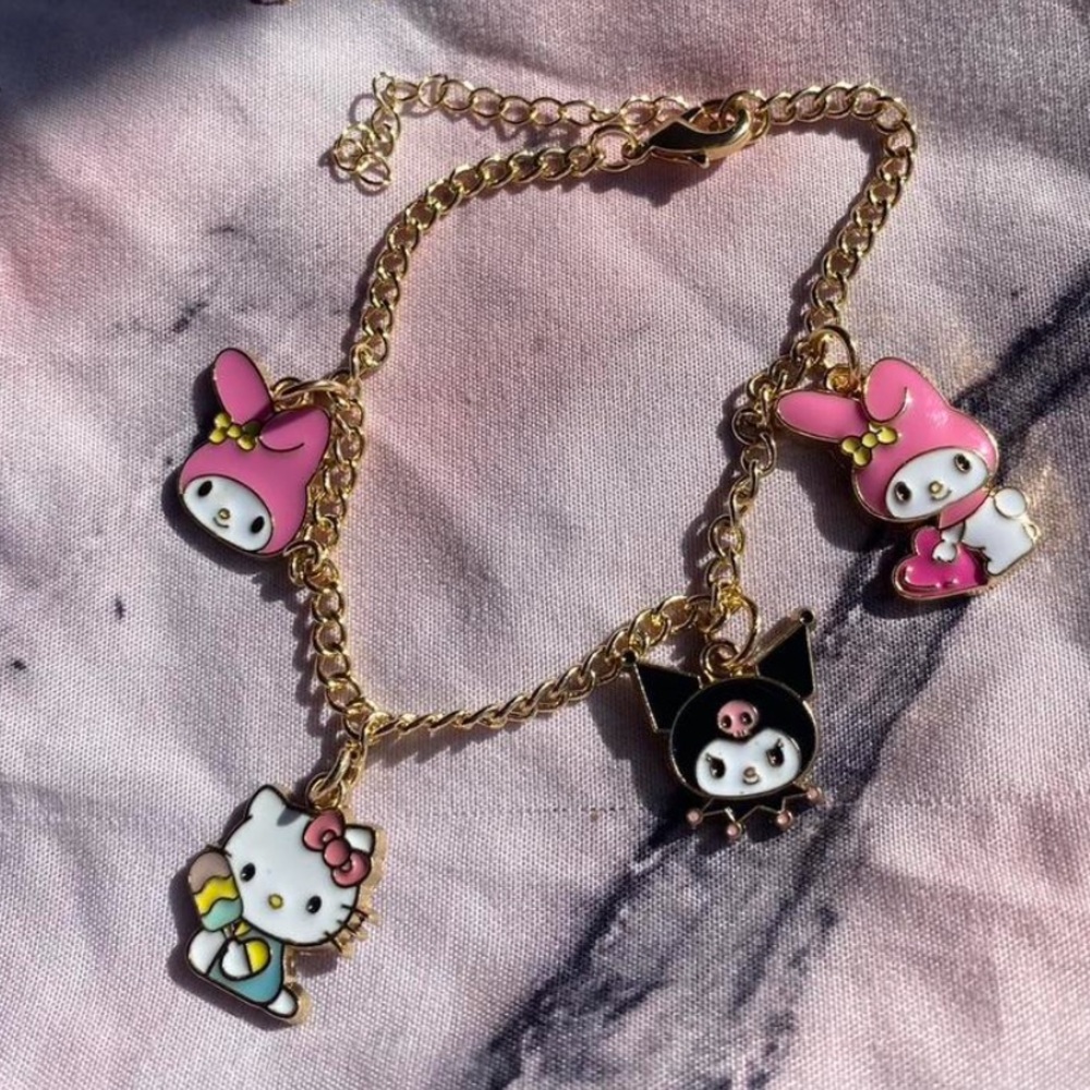 Handmade Sanrio gold charm bracelet featuring Hello Kitty, My Melody, and Kuromi